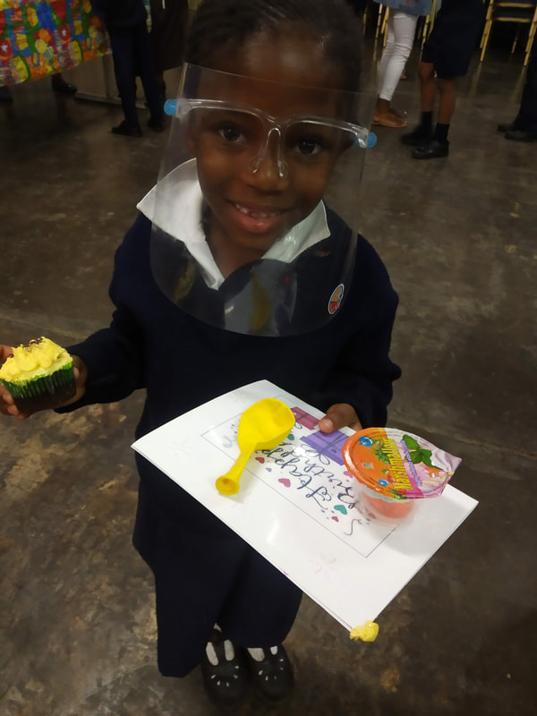 A Victory Learning Centre student displaying school work
