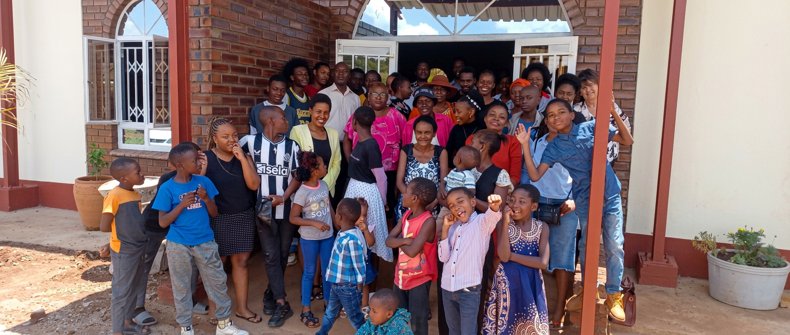 The Victory Fellowship Queen’s Park congregation gathered in front of the church building